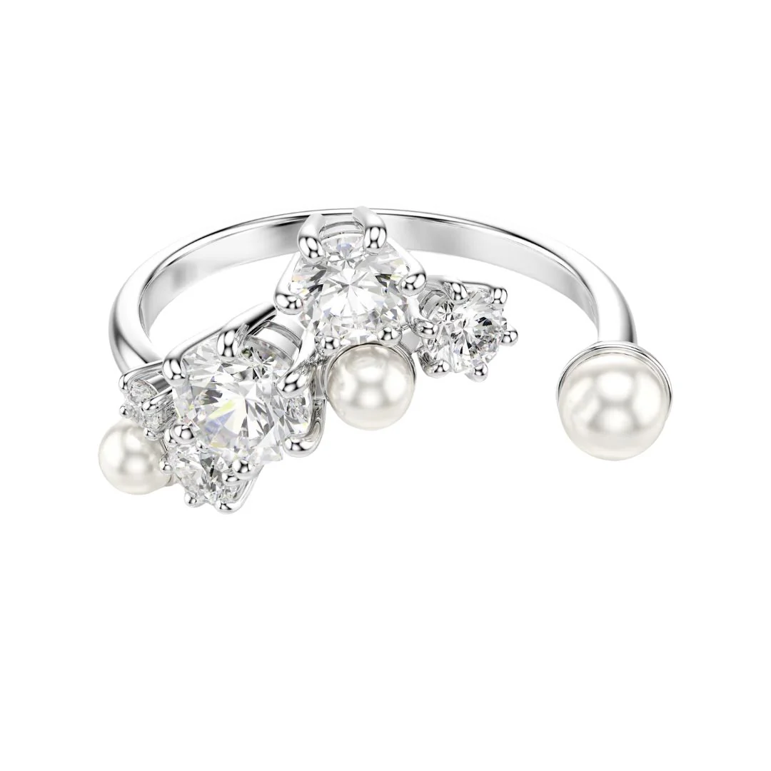 Swarovski Constella sormus, vaalea metalli kirkkailla kristalleilla ja valkoisilla helmillä